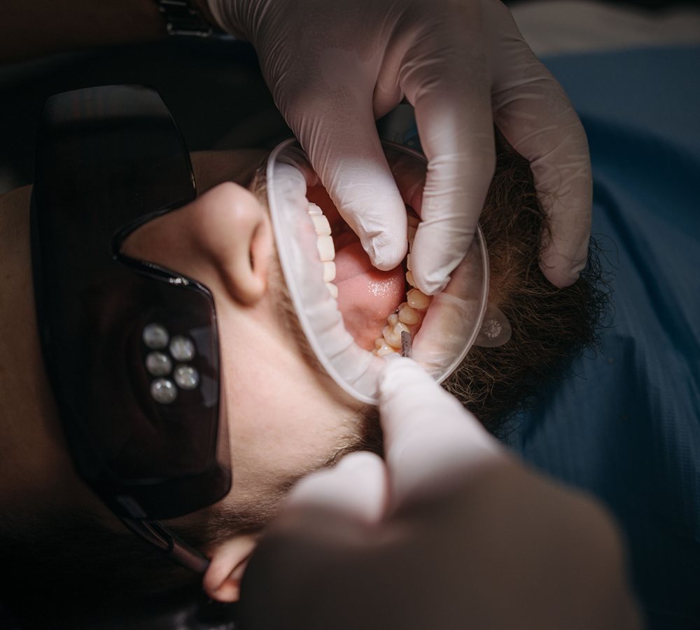 Periodontist examining a patient after a dental injury