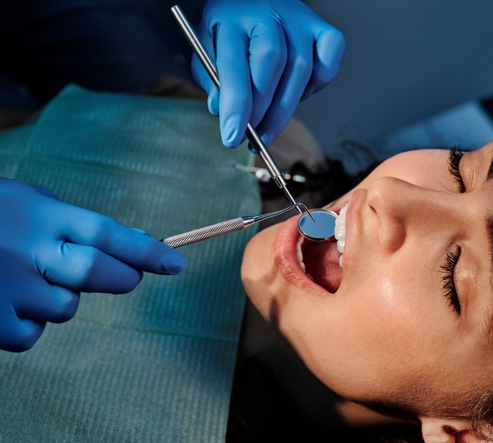Close examination of oral tissue during a periodontal visit