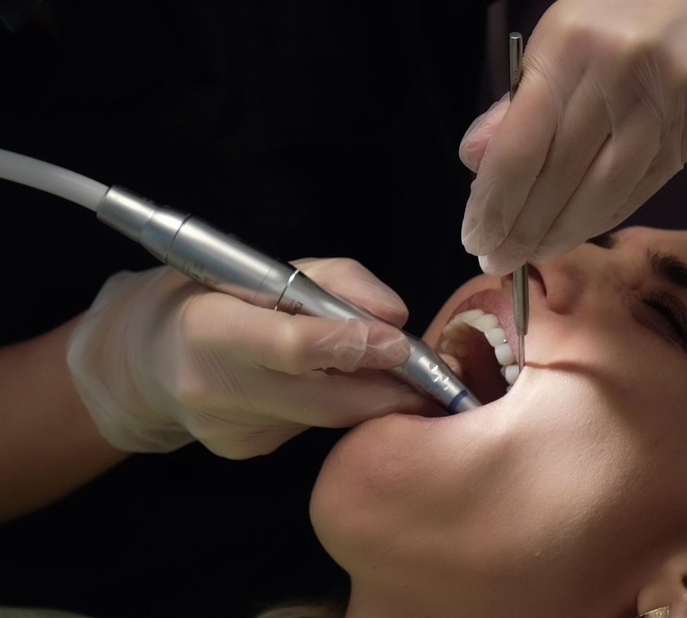 Periodontist performing scaling and root planing on a patient in Los Angeles