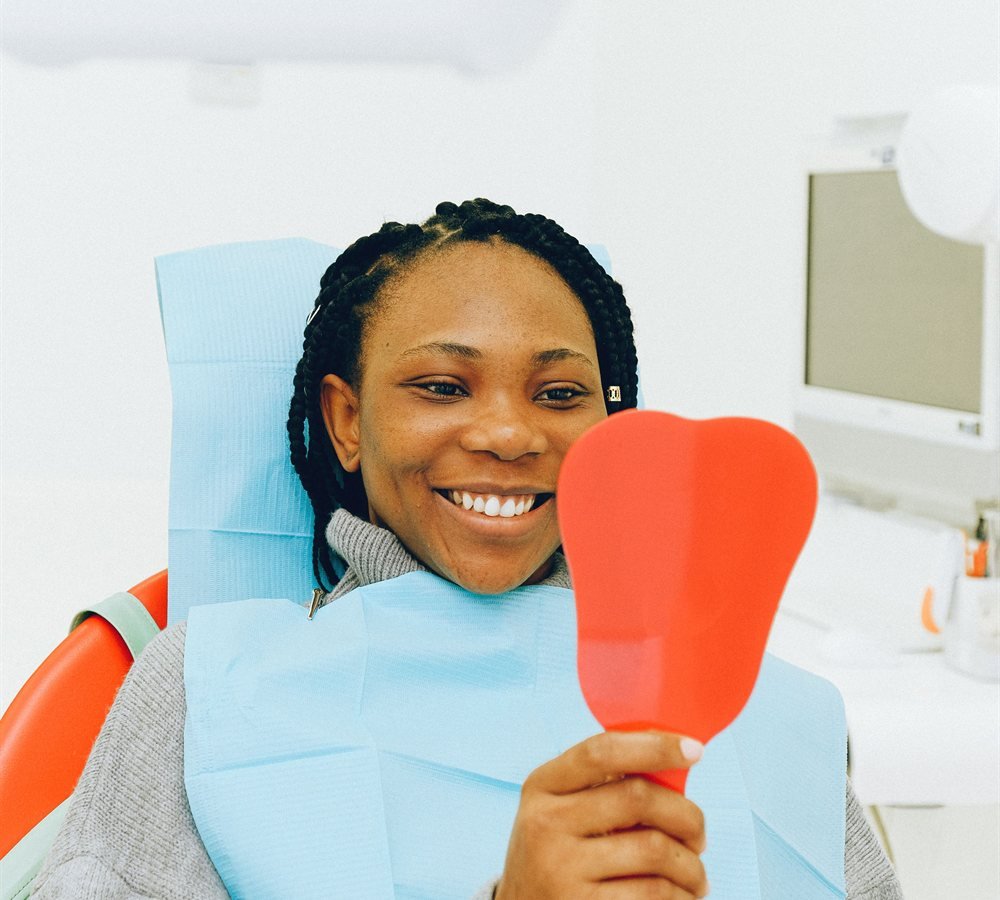 Patient smiling after single tooth implant restoration in Los Angeles